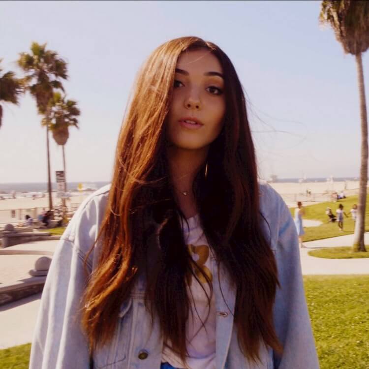 Girl with long brown hair in front of venice beach california Serenity Lynn Song of the Day | Eat Sleep Breathe Music