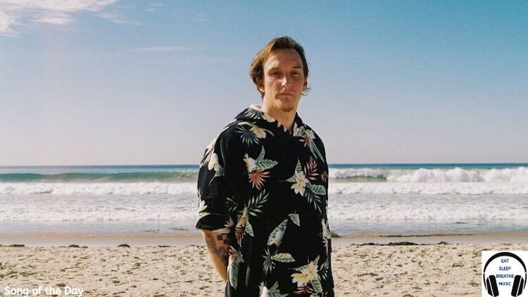 White man standing on a beach Ben Conley | Eat Sleep Breathe Music